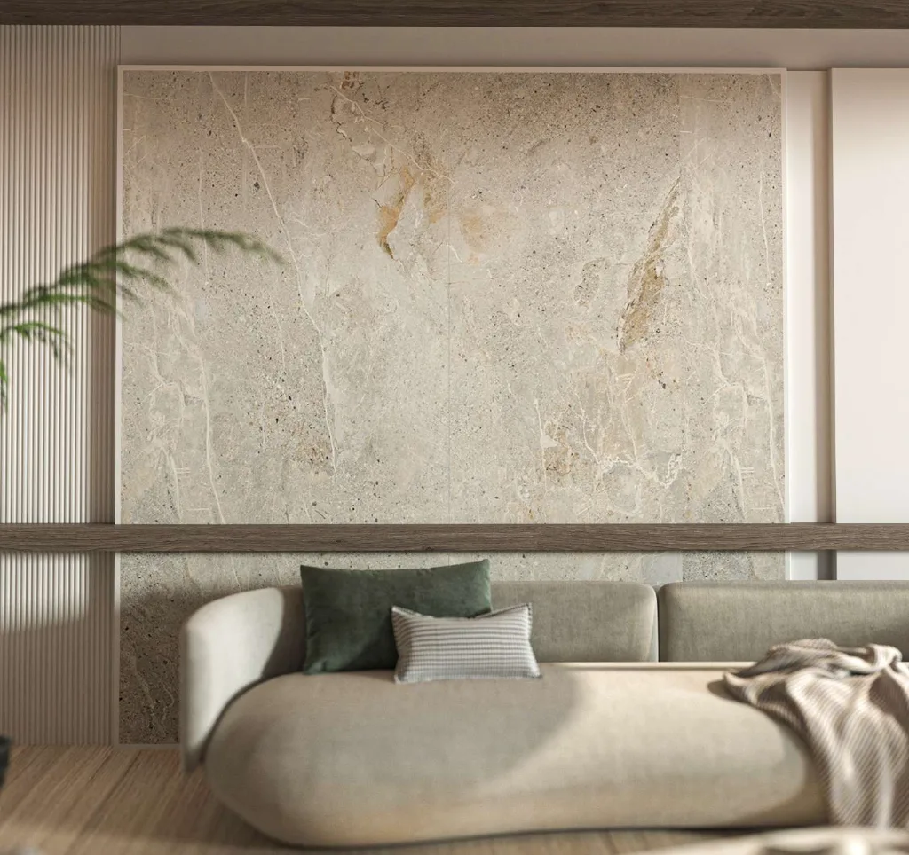 Living room with book-matched stone feature wall and large-format porcelain floor